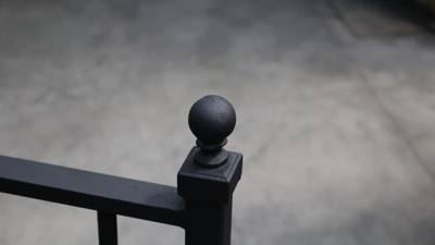 Ball finial above a square post at a railing corner