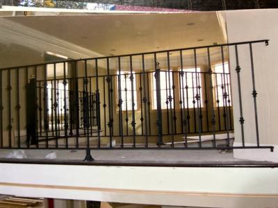 Black interior landing railing with small decorative collars