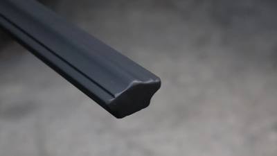 Black top rail profile with narrow raised edge details