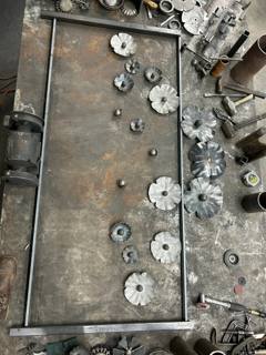 Workshop tabletop displaying flower shapes and round ornamental components